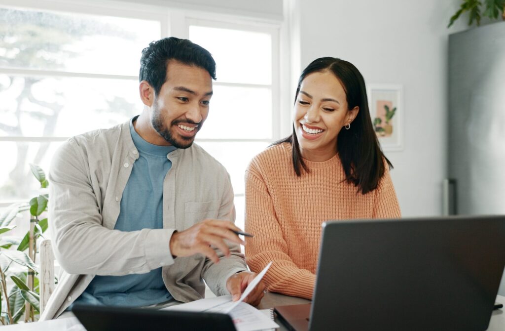 Kitchen,,Couple,And,Discussion,With,Laptop,For,Budget,,Track,Expenses